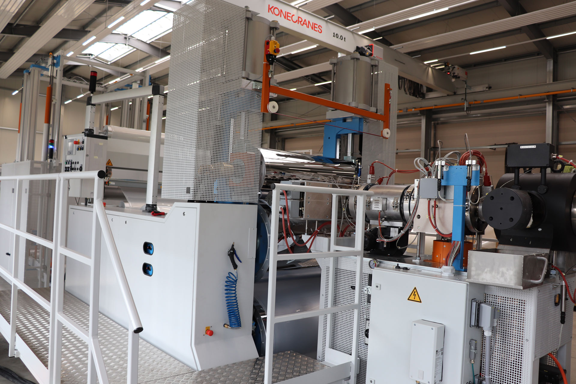 An extrusion machinery line for producing film, sheets and panels from polystyrene and polypropylene.